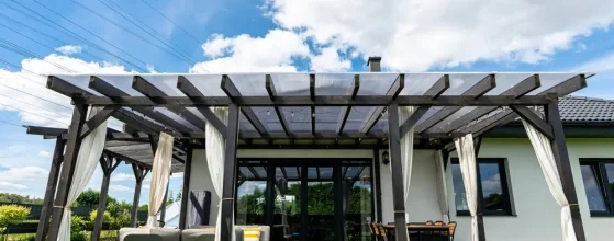 Modern covered patio attached to home with outdoor dining area