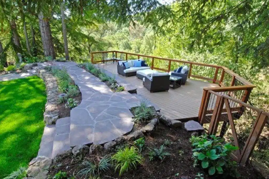Multi-level patio and outdoor living space on a sloped property