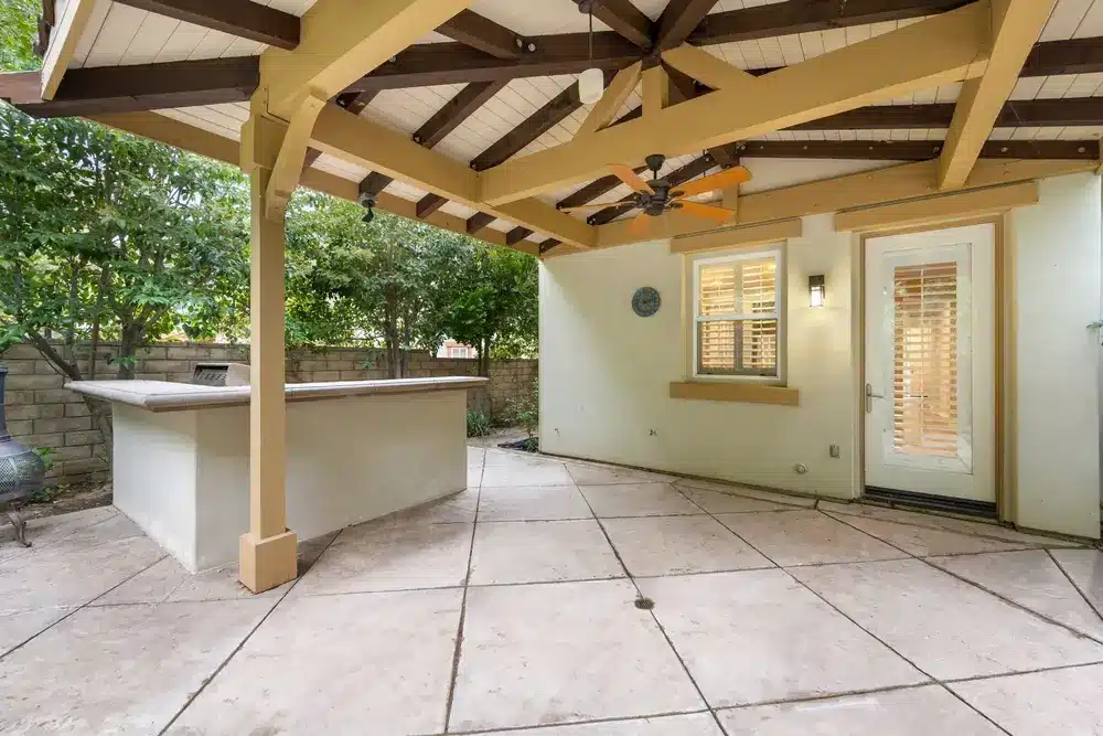 Outdoor living area featuring a solid roof covered patio