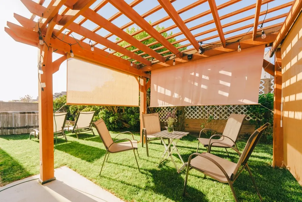 Decorative pergola adding partial shade to backyard patio